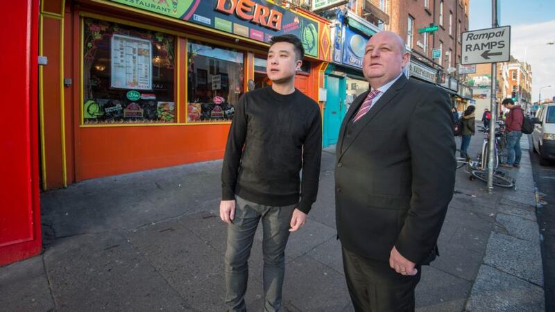 Dublin’s Chinatown: Yuyang Xin of Lao restaurant, on Parnell Street East, and Lorcan O’Connor of Carrolls Irish Gifts. Photograph: Brenda Fitzsimons