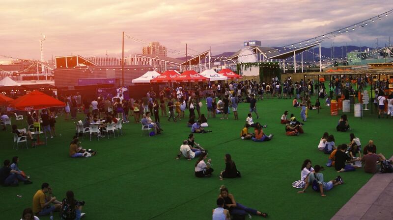 Groups mingle at a distance at Barcelona’s music festival.