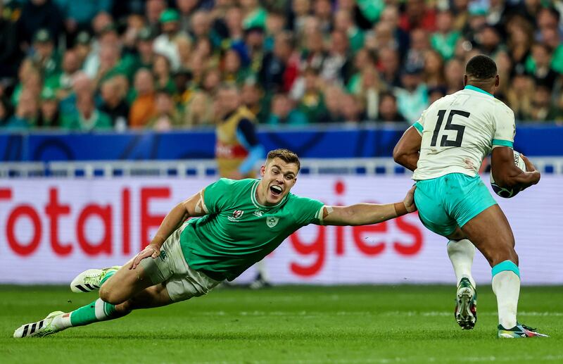 Garry Ringrose tries to stop Damian Willemse during Ireland's last meeting with South Africa, at last year's World Cup. Photograph: Dan Sheridan/Inpho