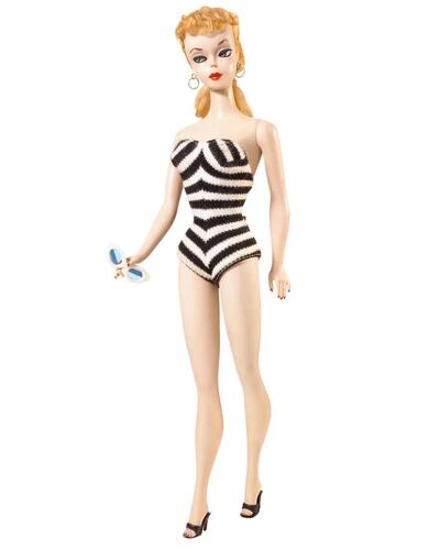 The first Barbie was officially introduced in a chevron stripe black and white bathing suit in 1959