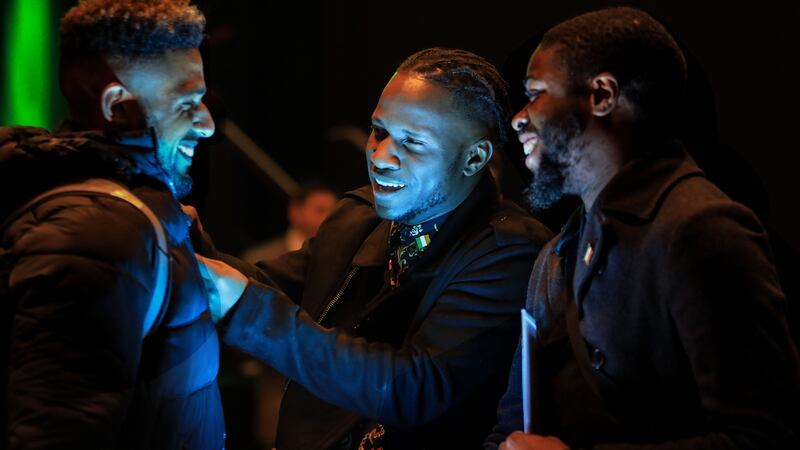 Left to right: Nathan Adams, originally from South Africa, Kenneth Okiria originally from Uganda and Randy Mazingu, DR Congo, all now living in Dublin, attending the citizenship ceremonies in Killarney. Photograph: Valerie O’Sullivan