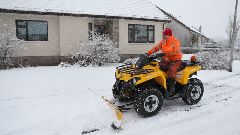 Jim Dunbar plows snow  near Stirling on Thursday, as blizzard conditions are set to bring ’a real taste of winter to the whole of the UK’. Photograph: Andrew Milligan/PA