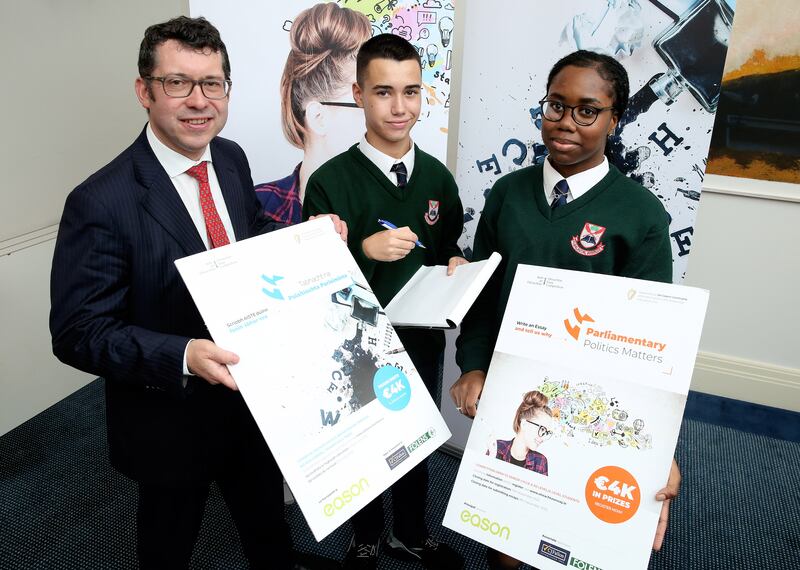 Senator Ronan Mullen with students Jaiden Grant and Chloe Efi at the launch of the Oireachtas Essay Competition.  Students are asked to register by November 15th, with the final date for submitting entries on December 8th. Photograph: John McElroy 