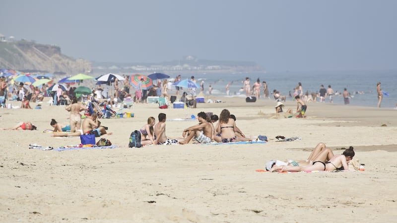 People take in the sun on the beach at Montauk. Photograph: James Leynse/Corbis via Getty Images