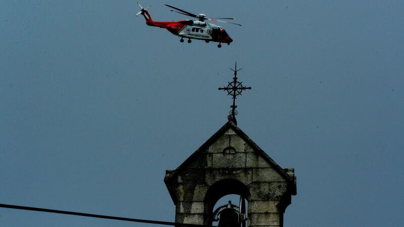 Irish Coast Guard helicopter performs a flyover at the funeral of Capt Dara Fitzpatrick. Photograph: Cyril Byrne/The Irish Times