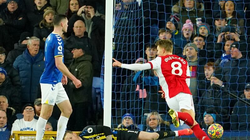 Arsenal’s Martin Odegaard celebrates opening the scoring at Goodison Park on the stroke of half-time. Photograph: Jon Super/AP