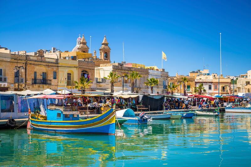 Marsaxlokk market with traditional Luzzu fishing boats. Photograph: iStock