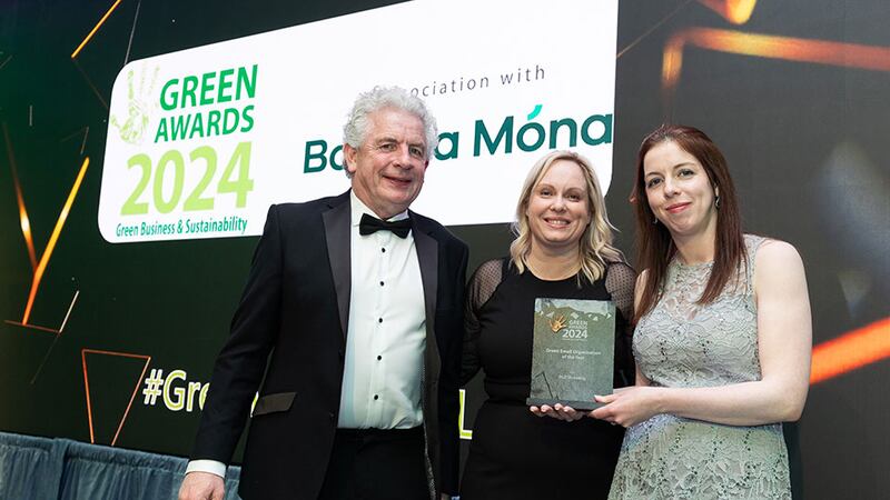 Louise Carrick head of marketing and customer experience at Calor, presents the green small organisation of the year award to Kelly Garvey and Liam Garvey, DGD Shredding