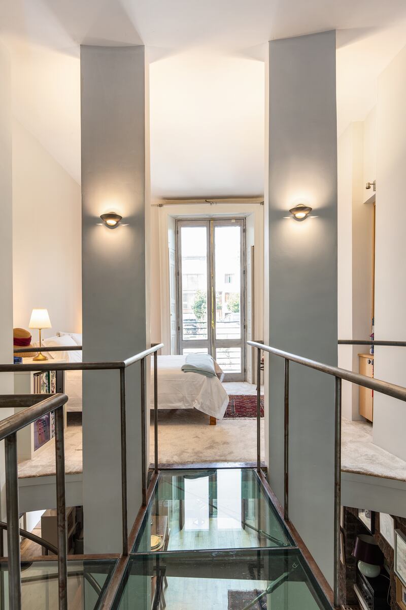 Garden-level unit: glass bridge leading to second bedroom