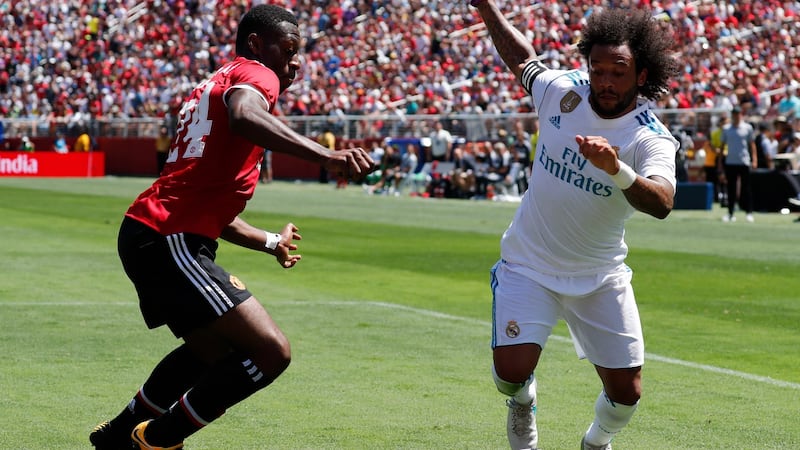 Marcelo goes past Fosuh-Mensah. Photo: John G Mabanglo/EPA