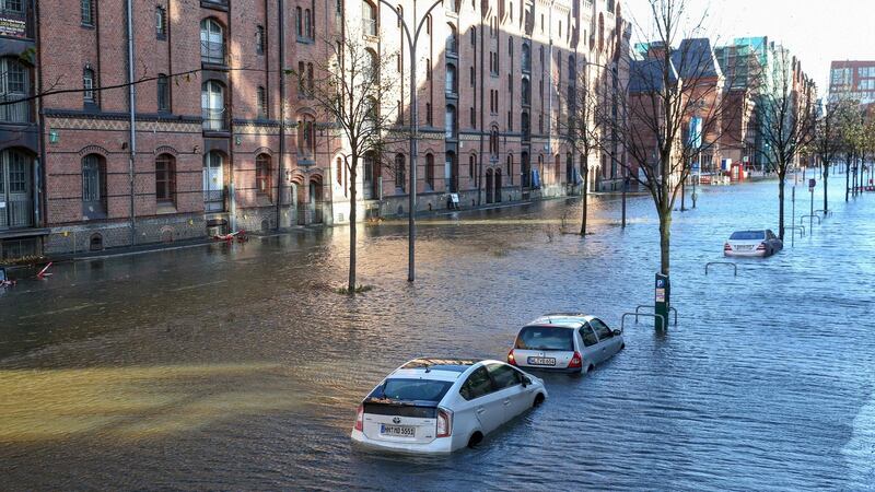Flood waters surround cars parked at Hamburg’s Fish Market district  as a storm hit many parts of Germany. Photograph: Bodo Marks/Getty Images