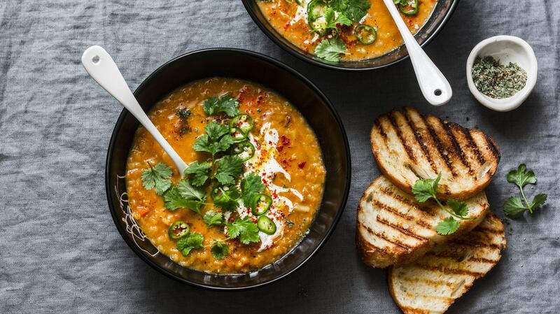 Turkish spiced lentil soup with fresh herbs and yoghurt, served with toast.