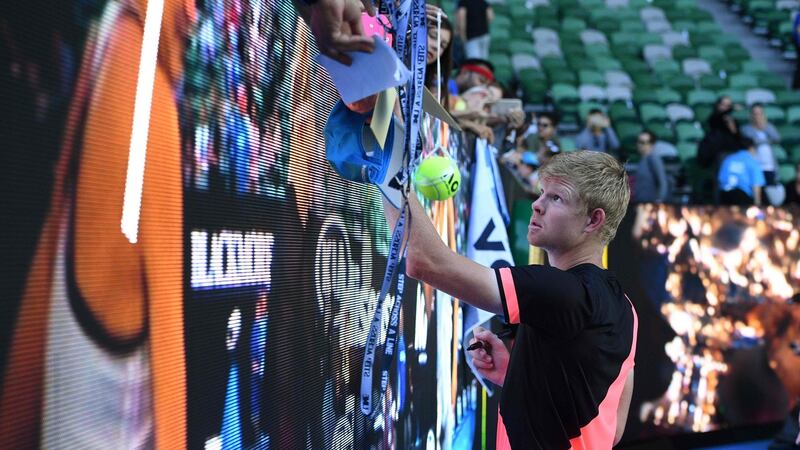 Edmund signs autographs after the match. Photo: William West/Getty Images