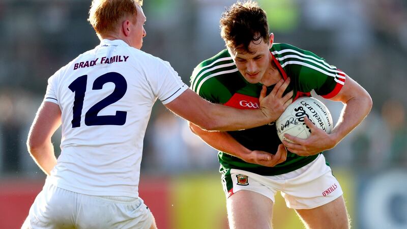 Kildare’s Keith Cribbin challenges  Diarmuid O’Connor of Mayo during  the All-Ireland SFC qualifier  at St Conleth’s Park in Newbridge. Photograph: James Crombie/Inpho