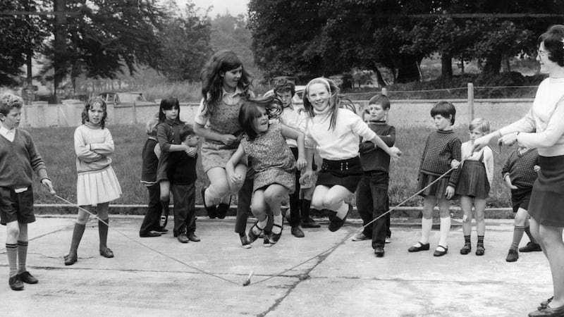 Young girls jump over a skipping rope in the playground of Donard National School, Co Wicklow, in October 1971. Photograph: Mirrorpix via Getty Images