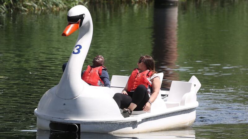 People ride on a boat in the Queen Elizabeth Olympic Park in east London. Photograph: Isabel Infantes/PA Wire