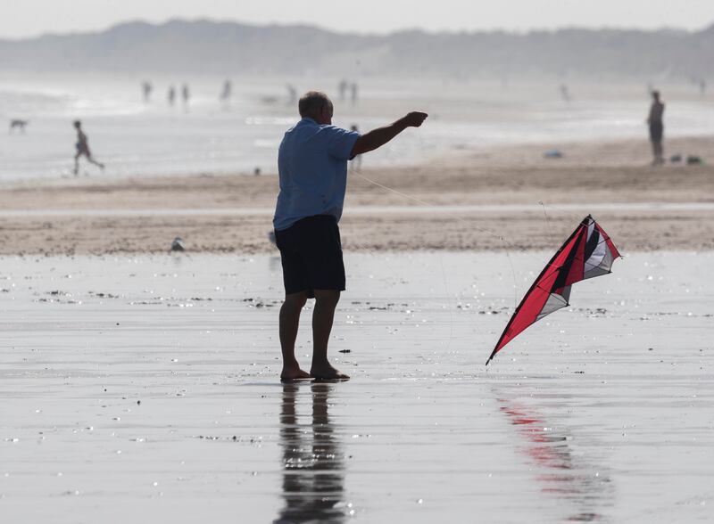 A man tries to get his kite airborne on Portmarnock Beach during the sunny weather. Photograph: Colin Keegan/Collins