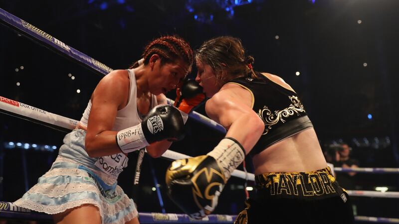 Katie Taylor  and Anahi Sanchez in action during their WBA Lightweight World Championship contest . Photograph: Richard Heathcote/Getty Images