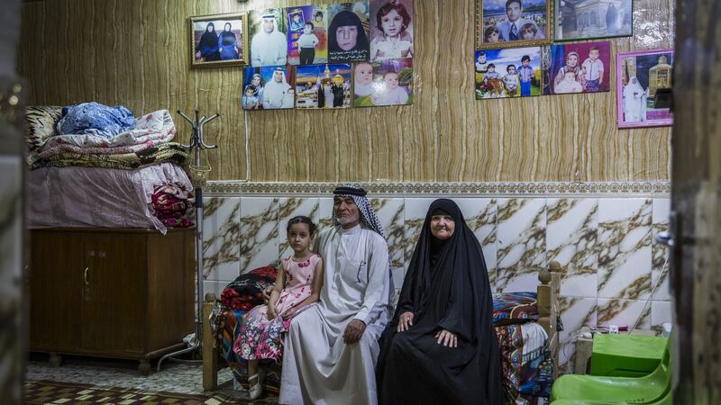 Stern, strict and traditional: Captain Sudani’s father, Abid al-Sudani, with his wife, Laisa Hashim Shuaith, and one of Sudani’s daughters.  Photograph: Ivor Prickett/The New York Times