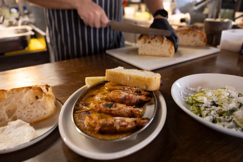 Gambas alla Borgo, with garlic, chilli, lemon, and focaccia