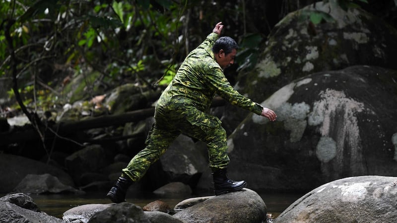 A member of a Malaysian rescue team takes part in the search. Photograph: Mohd Rasfan/AFP/Getty