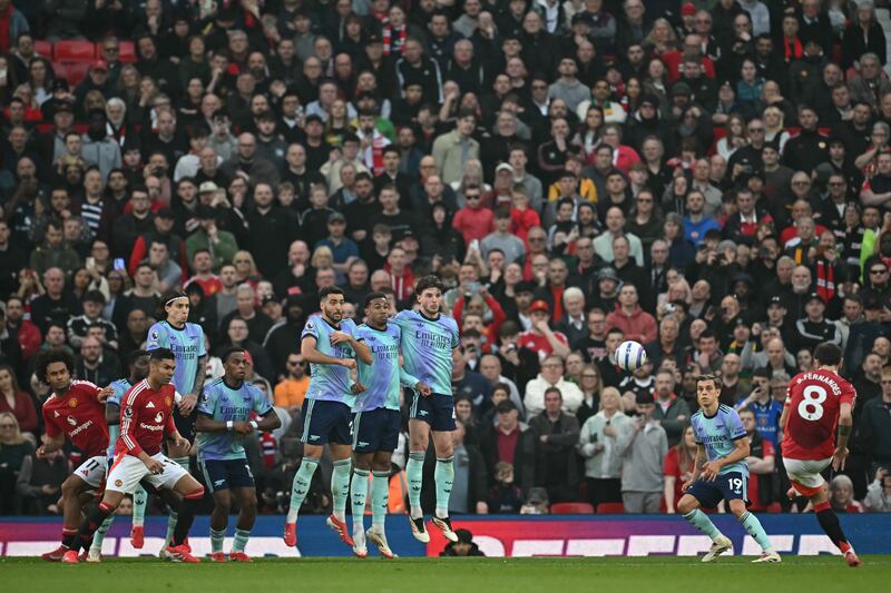 Manchester United's Bruno Fernandes curls a freekick towards the Arsenal goal, which David Raya did not protect very well. Photograph: Paul Ellis/AFP via Getty Images
