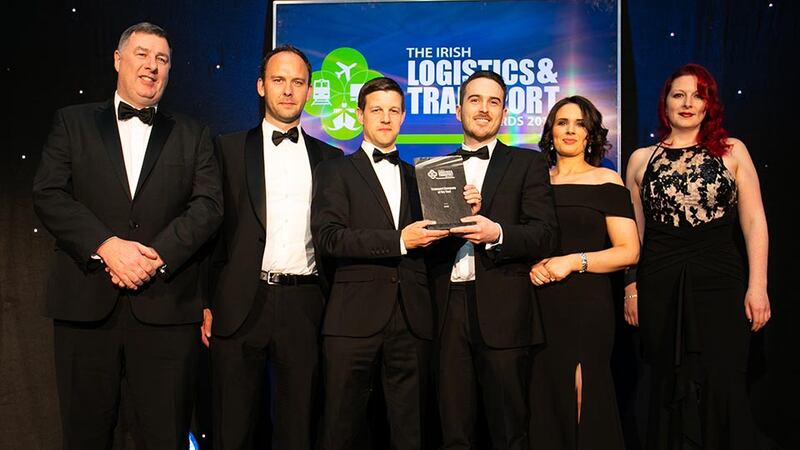 Garrett McClean, Executive Director, CBRE presents the Logistics & Transport Leader 2019 award to Pamela Quinn, Kuehne + Nagel.