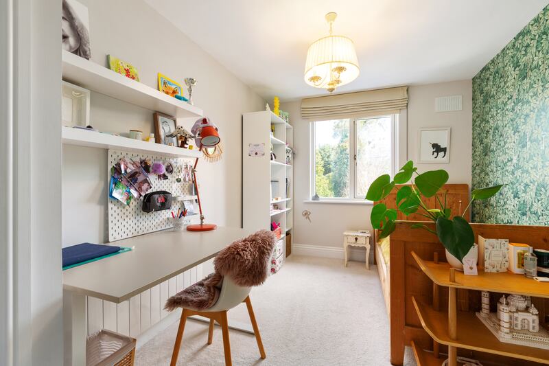 First-floor bedroom with feature wall