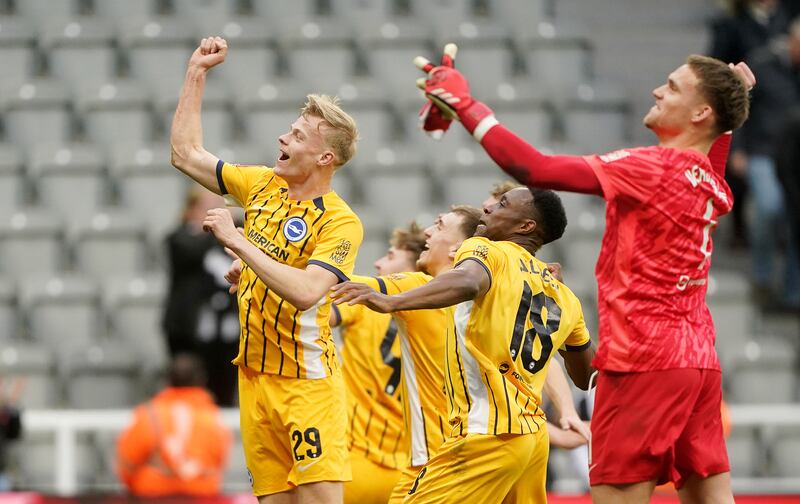 Brighton's Jan Paul van Hecke (left) and team-mates celebrate after the game. Photograph: Owen Humphreys/PA