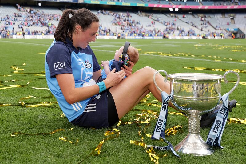 Dublin's Hannah Tyrrell celebrates after the game with her daughter, 7 weeks old Aoife/ Photograph: Laszlo Geczo/Inpho