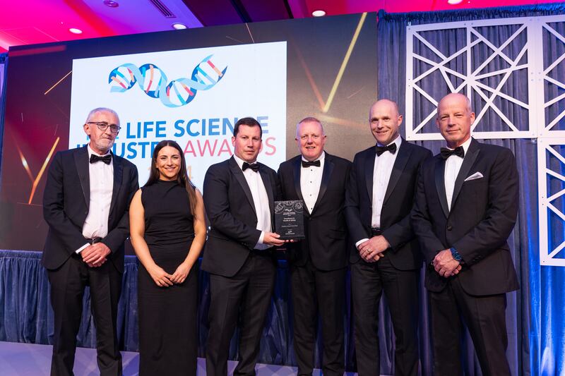 Tom O'Brien, business manager at Controlled Environments Company, presents the excellence in health & safety award to Astellas Ireland Kerry Plant team