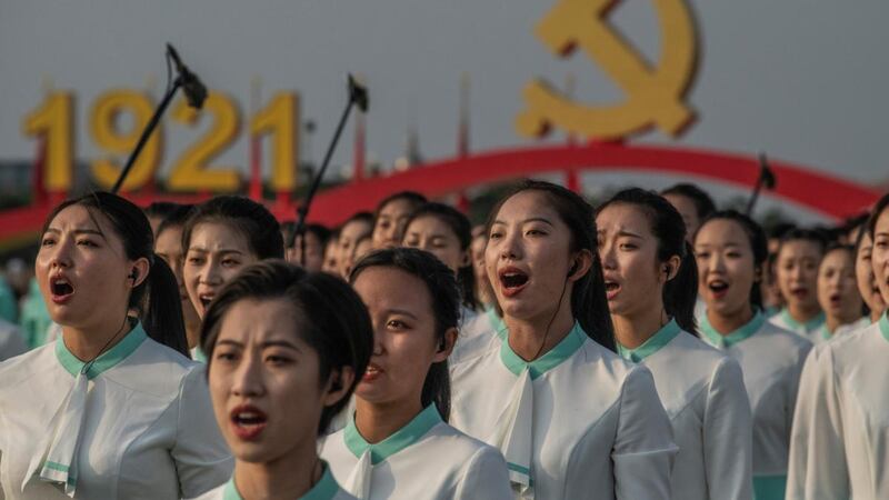 Chinese women sing at a ceremony marking the 100th anniversary of the Communist Party. Photograph: Kevin Frayer/Getty Images