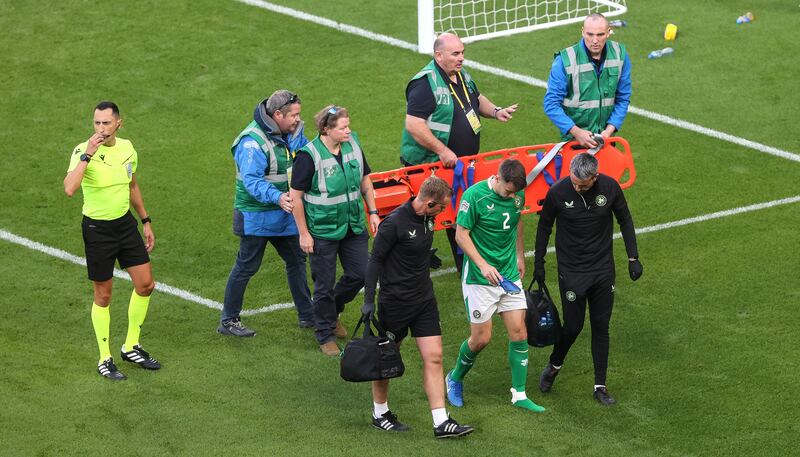 Ireland captain Séamus Coleman leaves the field with an injury. Photograph: Bryan Keane/Inpho