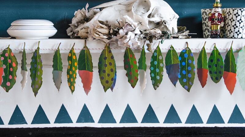 Annie Sloan’s simple garland –  foraged bay leaves dipped in paint and threaded with twine as a mantle garland.