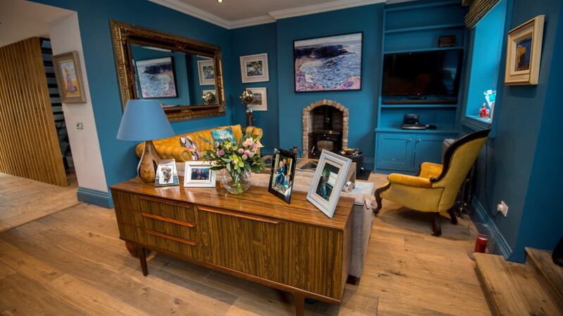 The vertical slatted wooden wall encloses the open thread staircase. Photograph: Brenda Fitzsimons