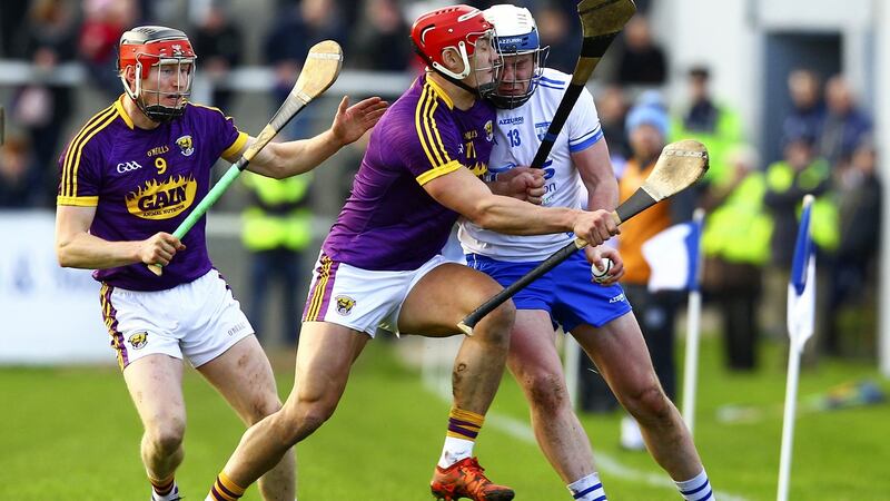 Waterford’s Stephen Bennett is tackled by Wexford’s Lee Chin. Photograph: Ken Sutton/Inpho