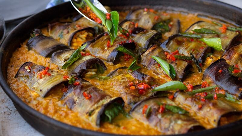 Stuffed aubergine in curry and coconut dal. Photograph: Jonathan Lovekin