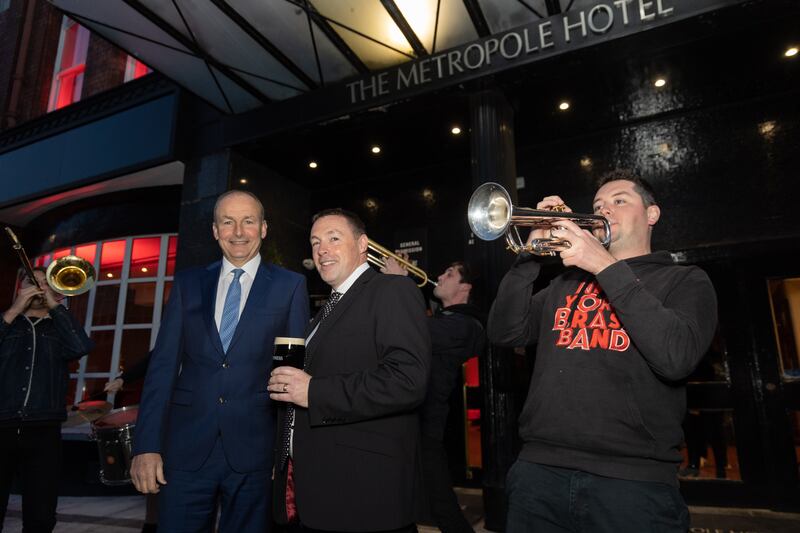 Tánaiste Micheál Martin and Diageo Ireland's Colin Kenny with members of the New York Brass Band at the opening night of the Guinness Cork Jazz Festival at the Metropole Hotel. Photograph: Darragh Kane