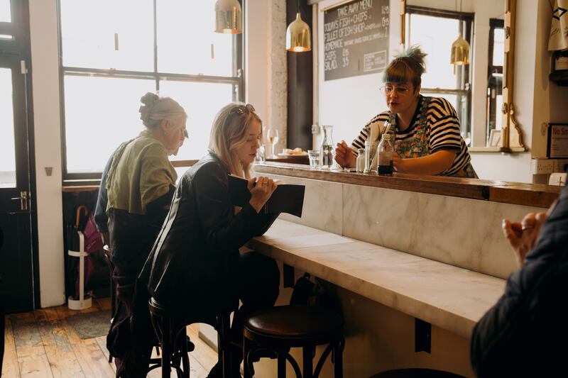 The tiny Fish Shop’s counters are lined with 14 stools. Photograph: Ellius Grace/the New York Times
