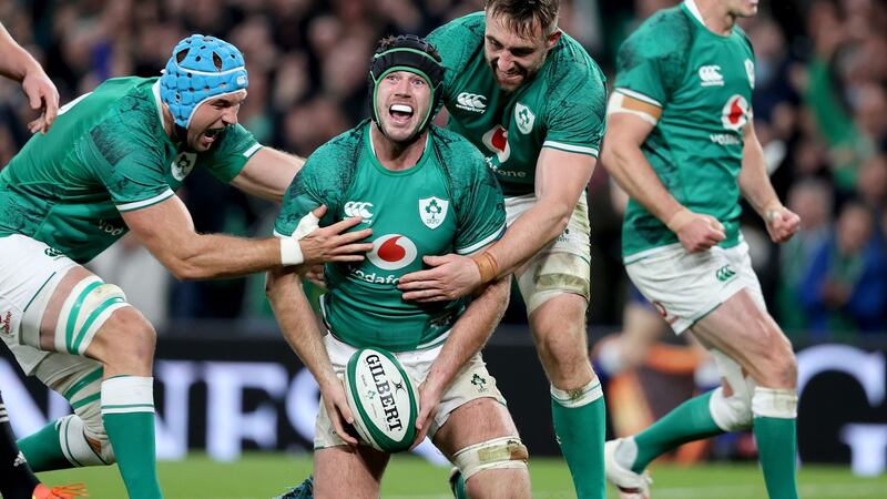 Ireland’s Caelan Doris celebrates a try against New Zealand with Tadhg Beirne and Jack Conan. Photograph: Dan Sheridan/Inpho