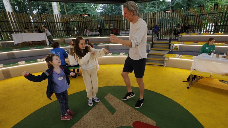 Saoirse, Leah and Steven Griffin get up for a dance in the amphitheatre during their family visit to Barretstown. Photograph: Alan Betson
