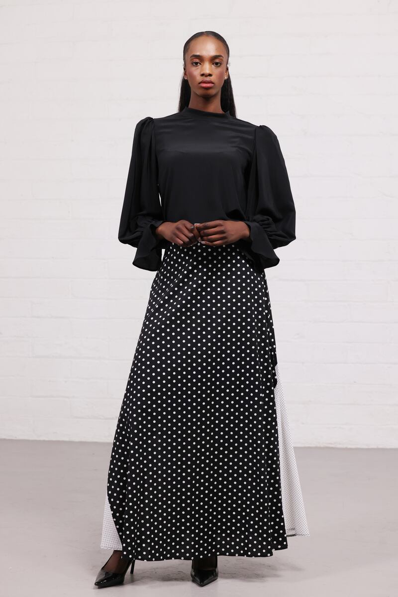 Black and white polka dot cotton skirt, €350, and black silk blouse, €350, by Cobblers Lane