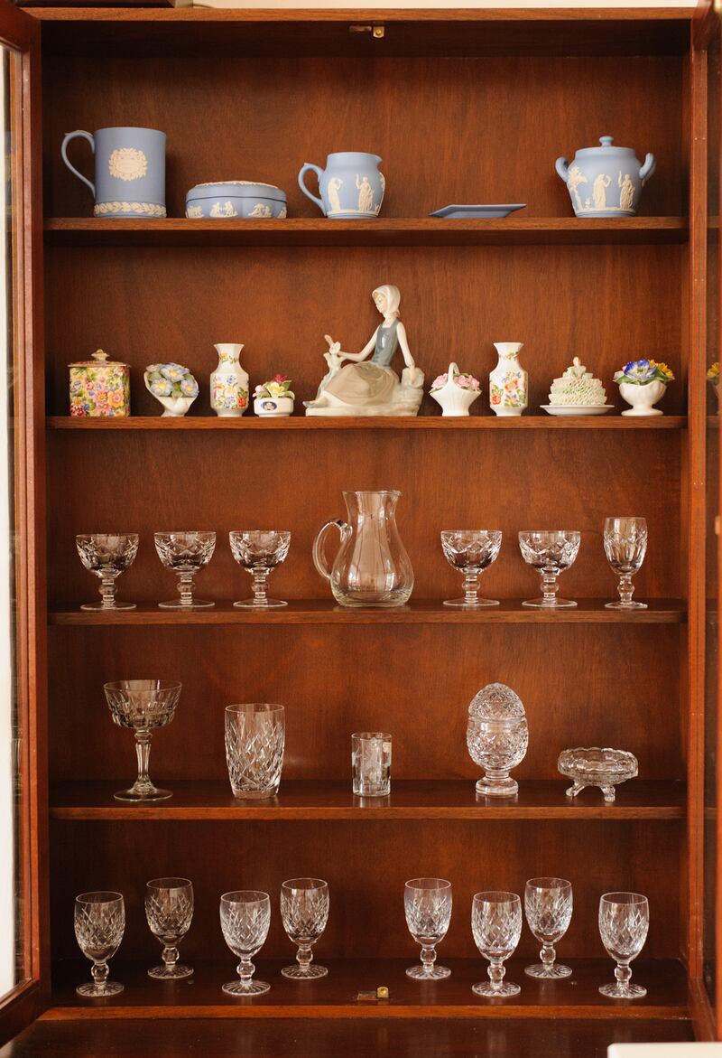 Carroll was able to salvage and re-frame their paintings, while cabinets retain treasured crockery, figurines and glassware. Photograph: Eoin Rafferty