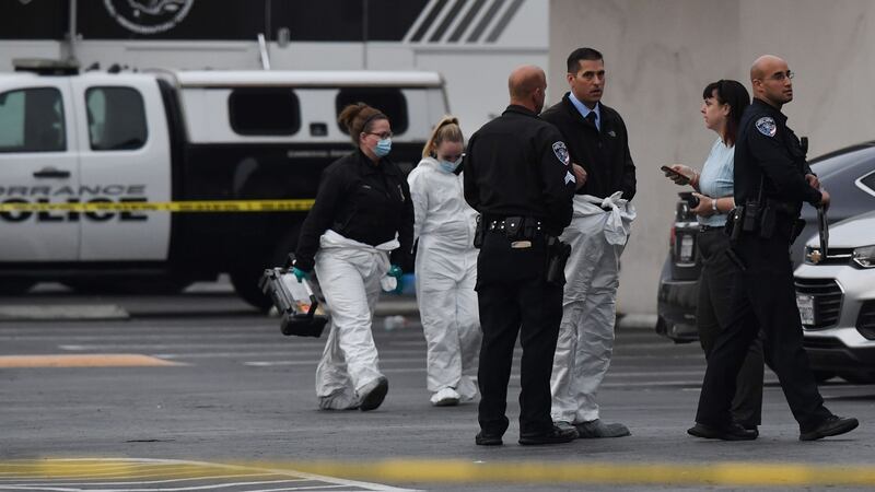 Investigators at the scene of the Gable House Bowl fatal shooting. Photograph: Getty