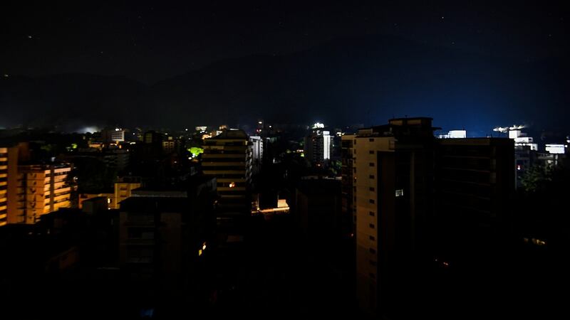 A distract in Caracas without light during a power outage. Photograph:  Juan Barreto/AFP/Getty Images