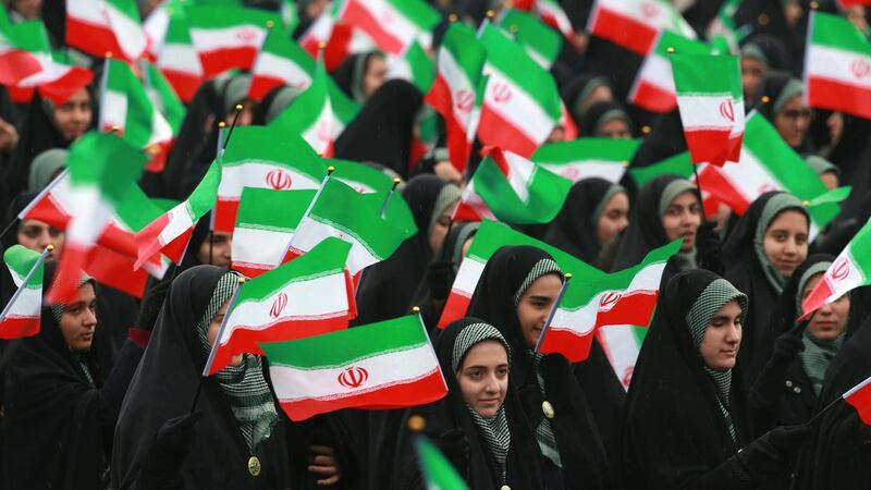 Iranians wave national flags during a ceremony celebrating the 40th anniversary of the Islamic Revolution, at Freedom Square, in Tehran, Iran. Photograph: Vahid Salemi/AP Photo