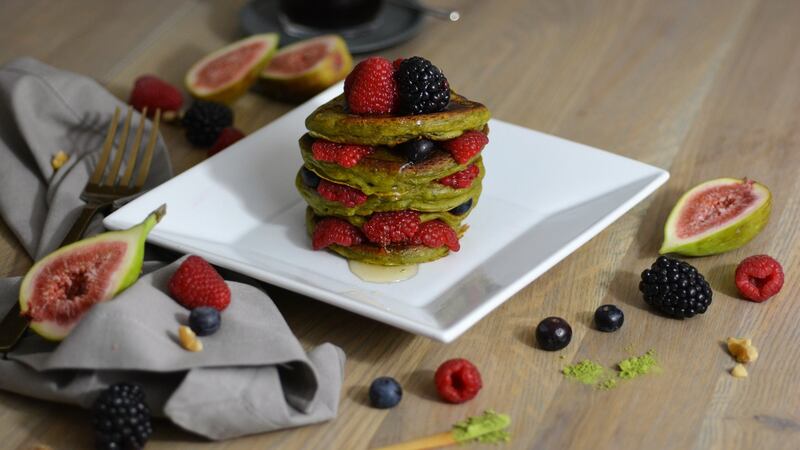 Matcha pancakes with fresh fruit and honey