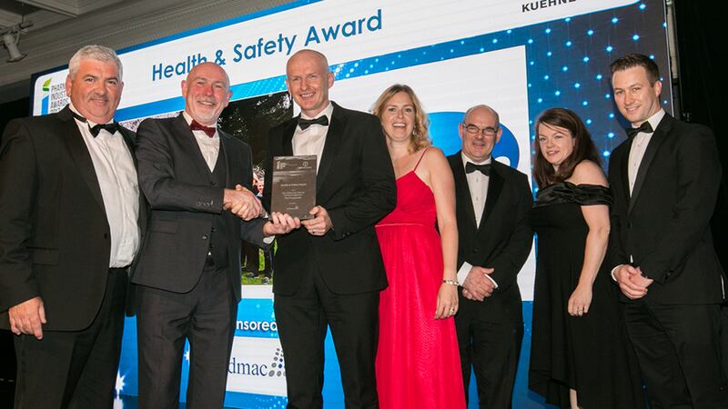 Colm Casey, Operational Director, Ardmac presents the Health & Safety Award to the Site Leadership Cultural Change Programme - Pfizer Ringaskiddy team