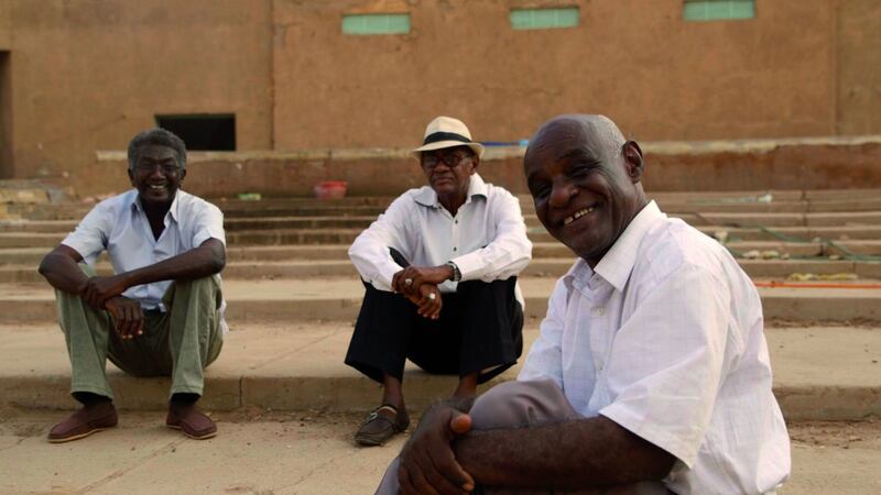 Three of the four members of the Sudanese Film Club in Talking About Trees