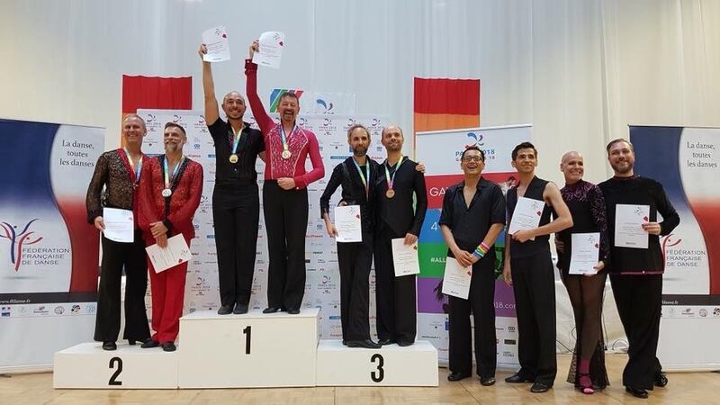 Peter O’Hare and his dance partner, Davide di Prete, on the podium at the Gay Games in Paris where they won gold